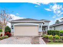 Charming single-Gathering home featuring a two-car garage, lovely landscaping, and a welcoming exterior at 937 Avery Meadows Way, Deland, FL 32724