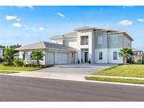 Stunning two-story home boasting a three-car garage and beautiful landscaping at 10032 Brocksport Cir, Gotha, FL 34734