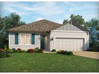 Charming single-story home with a well-manicured lawn and colorful landscaping enhancing its curb appeal at 3136 Legends Preserve Dr, Daytona Beach, FL 32124