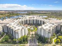Stunning aerial view of the community with a lake and lush landscaping at 14501 Grove Resort Ave # 3601, Winter Garden, FL 34787