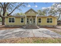 Charming single-story home featuring a welcoming entrance and well-manicured front yard at 2204 Votaw Rd, Apopka, FL 32703