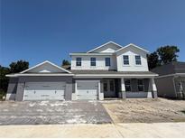 Beautiful two story home with a three-car garage and paved driveway at 2430 Francisco Art Ct, Oviedo, FL 32765