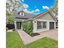 Charming single-story home with a brick walkway, well-kept lawn, and fresh exterior paint at 1517 E Esther St, Orlando, FL 32806