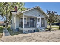 Charming home featuring a cozy screened-in porch and freshly painted exterior at 3807 S Sanford Ave, Sanford, FL 32773