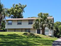 Charming two-story home with vinyl siding, a groomed lawn, and mature trees at 500 Forest Lake Dr, Altamonte Springs, FL 32714