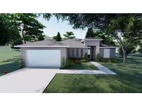 Charming single-story home with a manicured lawn, a two-car garage, and inviting curb appeal at 30369 Apricot Ave, Eustis, FL 32736