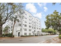 Attractive multi-story condo building with white and gray facade near a well-maintained street at 202 E South St # 5046, Orlando, FL 32801