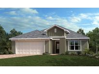 Charming single-story home with a two-car garage, manicured lawn, and classic architectural details at 3465 Sanctuary Dr, Clermont, FL 34714