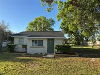 Charming single-story home with green front door and well-maintained landscaping, inviting curb appeal at 508 W Crescent Dr, Lakeland, FL 33805