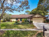 Charming single-story home with well-manicured lawn and lush landscaping in a desirable neighborhood at 1312 Golfside Dr, Winter Park, FL 32792