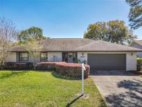 Charming single-story home with a well-maintained lawn and inviting curb appeal at 1617 E Sandpiper Trl, Casselberry, FL 32707