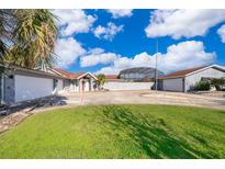 Spacious home featuring an attached three-car garage and a screened-in pool at 372 Rest Haven Rd, Geneva, FL 32732