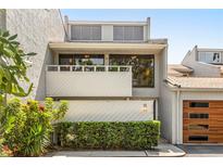 Charming multi-story townhome featuring a balcony and a well-manicured front garden at 378 Lakeview St, Orlando, FL 32804