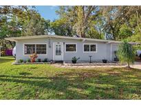 Charming single-story home with manicured lawn and inviting front entrance at 742 Valencia Ave, Orange City, FL 32763