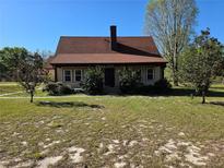 Charming single-story home featuring a classic design and well-maintained front yard at 9272 Gotha Rd, Windermere, FL 34786