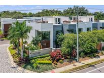 Contemporary townhomes boasting modern architecture and lush landscaping in a desirable community at 1816 Mondrian Cir, Winter Park, FL 32789