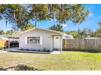 Charming single-story home with well-maintained lawn and landscaping, featuring a convenient carport at 4915 Pocahontas Ln, Lakeland, FL 33810