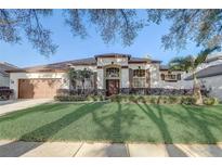 Inviting single-story home featuring a well-manicured lawn and attractive landscaping at 10112 Shortwood Ln, Orlando, FL 32836