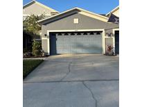 Exterior shot of home showing garage door, roof line, and driveway at 1247 Travertine Ter, Sanford, FL 32771