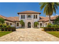 Stunning two-story home with a tile roof and manicured landscaping at 14645 Isleview Dr, Winter Garden, FL 34787
