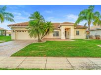 Charming single-story home with lush green lawn and well-maintained landscaping at 3403 Great Pond Dr, Kissimmee, FL 34746