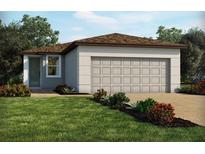Charming single-story home with a two-car garage and well-manicured lawn at 4010 Copperleaf Ln, Poinciana, FL 34759