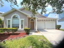 Charming single-Gathering home with a two-car garage and well-maintained landscaping at 12863 Holdenbury Ln, Windermere, FL 34786