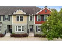 Charming townhome with colorful facade, neat landscaping, and inviting entrance at 1341 Mill Stream Ln, Winter Springs, FL 32708