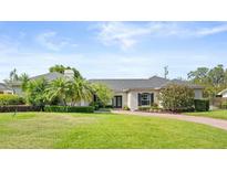Charming single-story home with lush landscaping and a well-manicured lawn at 2527 Mohawk Trl, Maitland, FL 32751