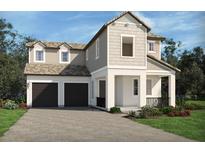 Charming two-story home with a two-car garage, neutral colors, and well-maintained landscaping at 16354 Silver Grove Blvd, Winter Garden, FL 34787