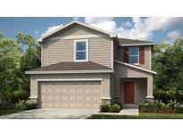 Charming two-story home with neutral siding, a two-car garage, and simple landscaping at 386 Wayland Dr, Haines City, FL 33844