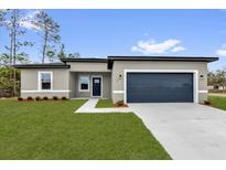 Charming single-story home featuring a well-maintained lawn and a two-car garage at 531 Marion Oaks Blvd, Ocala, FL 34473