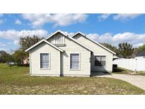 Charming single-story home with a quaint front facade and well-maintained lawn at 605 Swallow Ct, Apopka, FL 32712