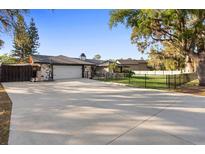 Charming exterior of a single-story home with an attached garage and a well-maintained front yard at 1475 Kettledrum Trl, Deltona, FL 32725