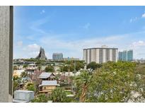 Expansive city view featuring buildings and landscaping under a blue sky at 6165 Carrier Dr # 3701, Orlando, FL 32819