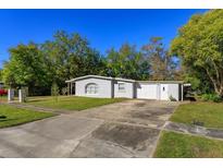 Charming single-story home with well-maintained lawn, driveway, and attached one car garage at 1132 W Page Dr, Deltona, FL 32725