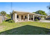 Charming single-story home with a covered carport and well-maintained front yard at 1716 2Nd Ne St, Winter Haven, FL 33881