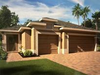 Beautiful home exterior featuring a two-car garage, stucco finish, and meticulously maintained landscaping at 179 Blue Cypress Dr, Davenport, FL 33837