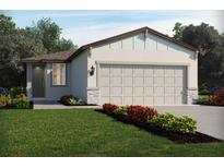 Charming single-story home with a well-manicured lawn and a two-car garage with stone accents at 2507 Linda Knoll Ln, Bartow, FL 33830