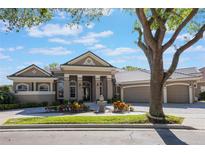 Stunning single-story home boasting an elegant exterior, manicured landscaping and a paver driveway at 703 Cricklewood Ter, Lake Mary, FL 32746