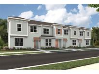 New townhome construction shows clean lines and modern design, complementing a lovely street at 2327 Distant Sun Trl, Kissimmee, FL 34747