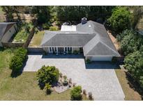 An aerial view of the single story home with a grey roof and paver driveway at 352 Ridgewood St, Altamonte Springs, FL 32701