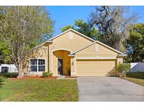 Inviting single-Gathering home with a well manicured lawn and two car garage at 4424 Park Eden Cir, Orlando, FL 32810