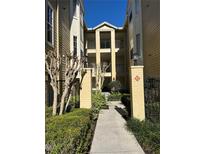 Inviting condo exterior with pathway and landscaping, offering a charming welcome at 413 Summit Ridge Pl # 115, Longwood, FL 32779