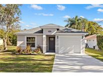 Charming single-Gathering home with a well-maintained lawn and a one-car garage at 5790 Crystal Beach Rd, Winter Haven, FL 33880