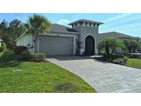 Charming single-story home featuring a well-manicured lawn and inviting curb appeal at 225 Vestrella Dr, Kissimmee, FL 34759