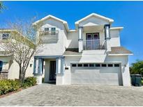 Charming two-story home featuring a two-car garage and an inviting entryway with a balcony at 7483 Marker Ave, Kissimmee, FL 34747