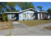 Charming single-story home with blue siding and white trim, plus mature trees and landscaping at 2525 S Sanford Avenue Ave, Sanford, FL 32773