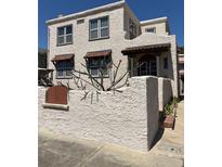 Exterior view of the home with a stucco wall on a bright day at 529 Hillside Nw Ave, Daytona Beach, FL 32118
