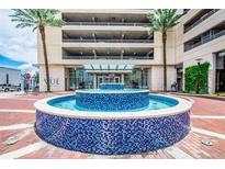 The Vue at Lake Eola entrance, showing the water feature, front facade and landscaping at 150 E Robinson St # 2608, Orlando, FL 32801
